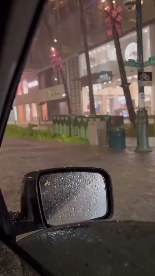 Dangerous flooding and high water in Hawaii. Waikiki flooding on Kalakaua Avenue.